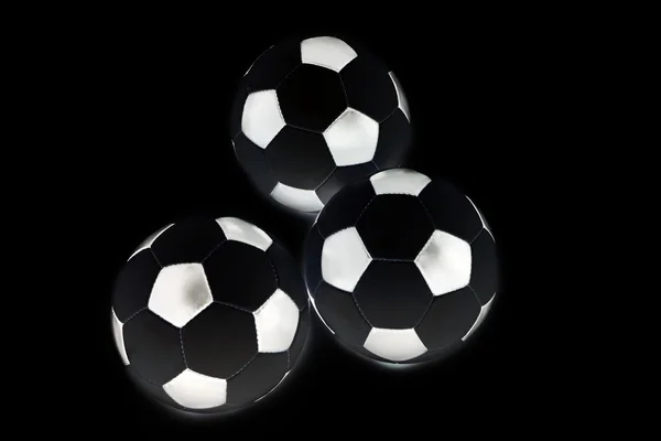 Football soccer ball. Three Balls isolated on black Background. — Stock Photo, Image