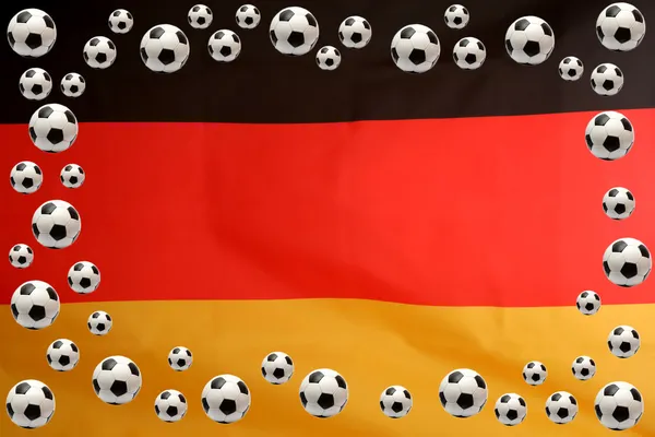 Μπάλες ποδοσφαίρου σε γερμανική σημαία φόντο — Φωτογραφία Αρχείου