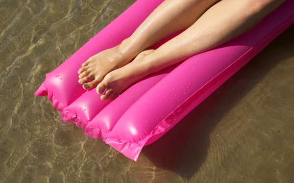 Floating feet in the sunshine — Stock Photo, Image