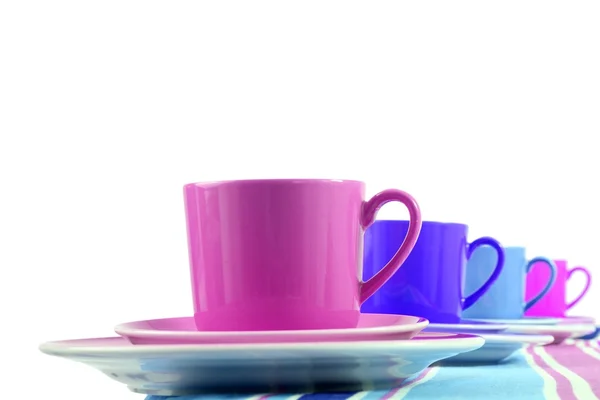 Bunte Kaffeetasse und Untertasse auf weißem Hintergrund — Stockfoto