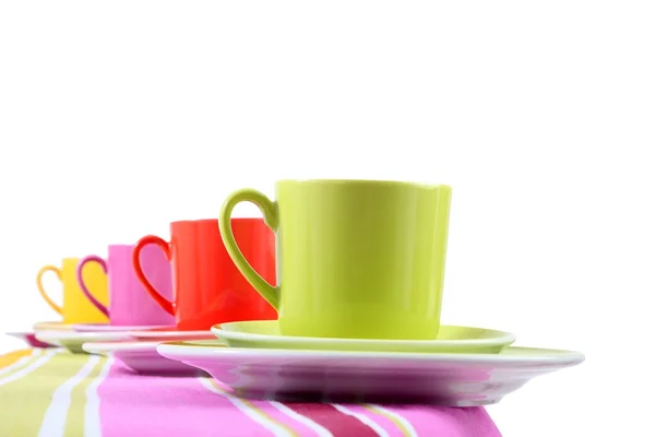 Bunte Kaffeetasse und Untertasse auf weißem Hintergrund — Stockfoto