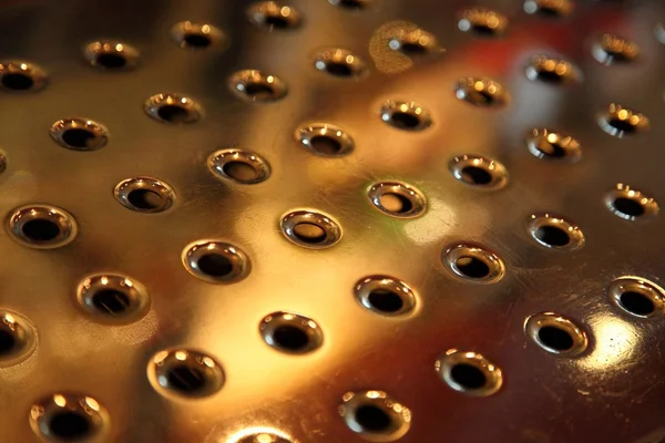 Metal surface with holes — Stock Photo, Image