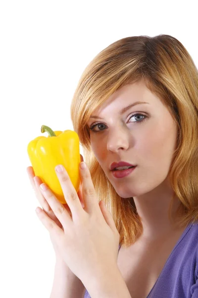 Young beauty with yellow paprika . white background — Stock Photo, Image