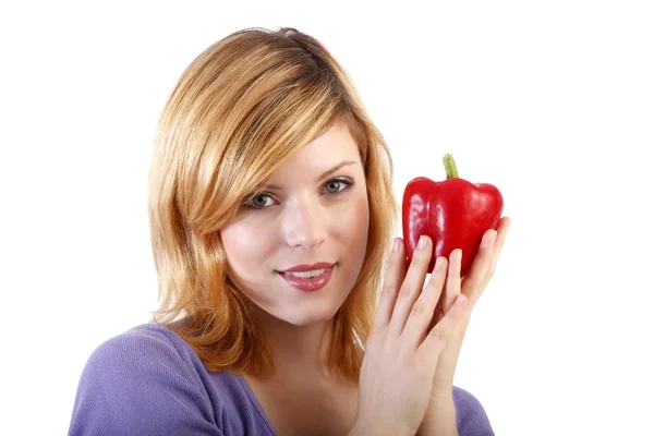 Young beauty with a red paprika .white background — Stock Photo, Image