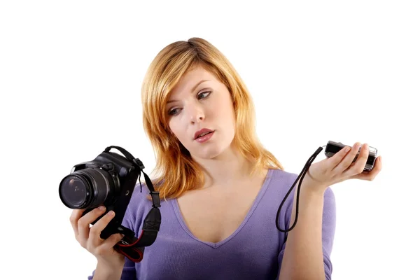 She holds single-lens reflex camera and compact camera — Stock Photo, Image