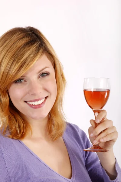 Girl drinking from a glass of wine — Stock Photo, Image