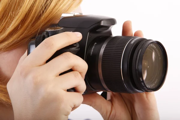 Young beautiful woman with a camera Stock Picture