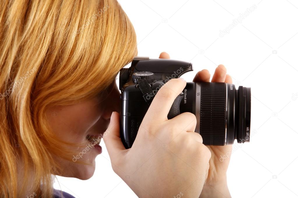 Young beautiful woman with a camera