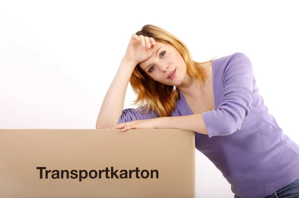 Young woman with moving boxes — Stock Photo, Image