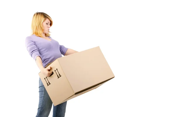 Young woman with moving boxes (white background) — Stock Photo, Image