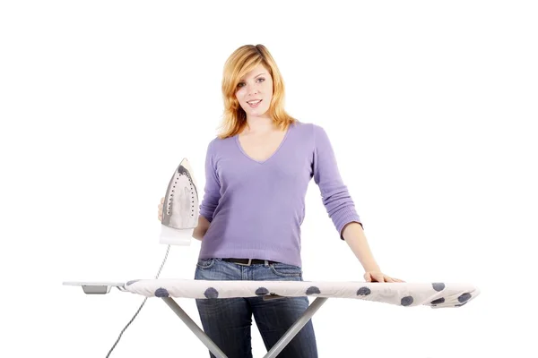 Beautiful young woman ironing (white background) — Stock Photo, Image