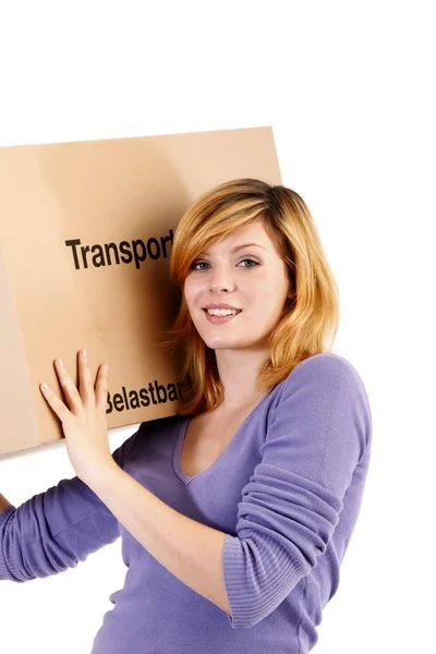 Young woman with moving boxes (white background) — Stock Photo, Image