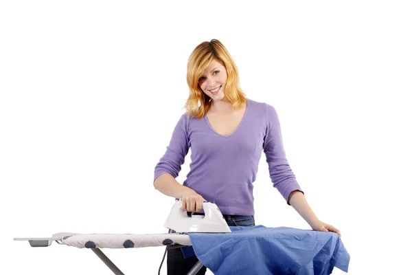 Beautiful young woman ironing (white background) — Stock Photo, Image
