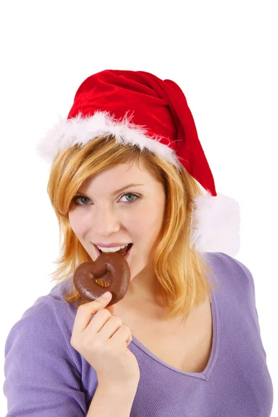 Giovane donna con cappello di Babbo Natale e pan di zenzero (sfondo bianco ) — Foto Stock