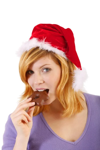 Young woman with santa hat and gingerbread (white background) — Stock Photo, Image