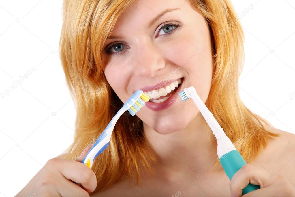 Young woman brushing teeth