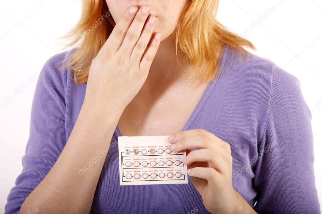 Woman with anti baby pill (white background)