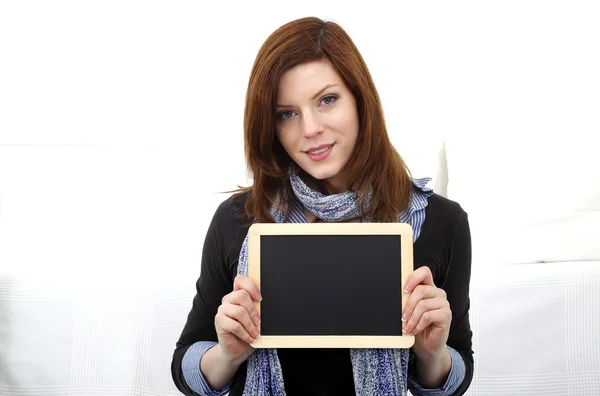 Young woman with blank panel — Stock Photo, Image
