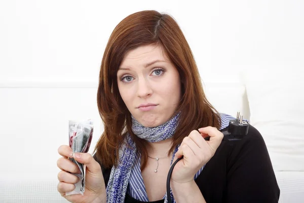 Young woman with plug and money — Stock Photo, Image