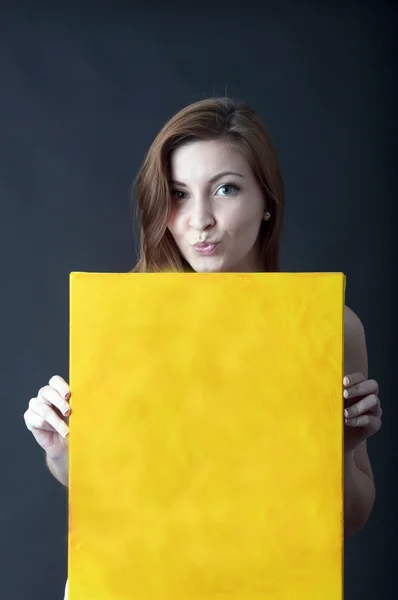 Woman with canvas panel — Stock Photo, Image