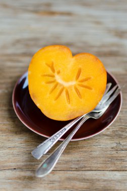 Heart-Shaped Persimmon, Nice Dessert For St.Valentine clipart
