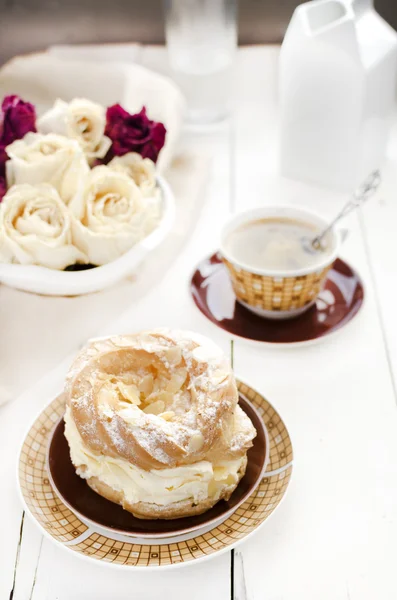 A Paris Brest, a French Dessert, and coffee — Stock Photo, Image