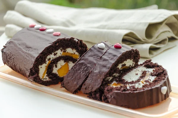 Breakfast: chocolate and persimmon roll — Stock Photo, Image