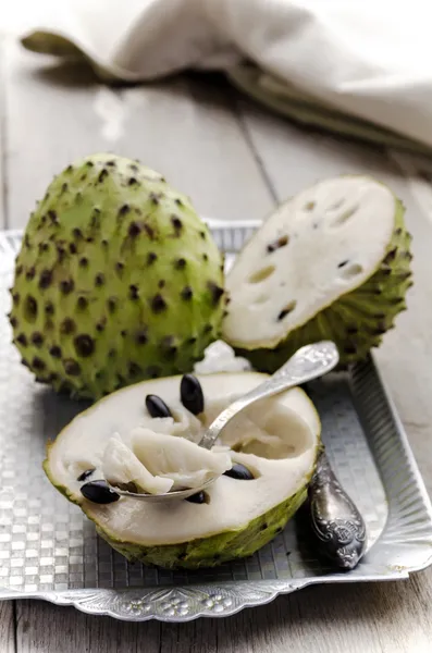 Annona cherimola served on a vintage metal tray — Stock Photo, Image