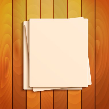 Blank sheets of paper on the background a wooden surface.station clipart