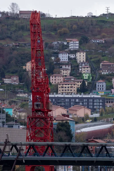 red crane of an old shipyard in the center of bilbao