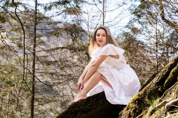 Blonde Woman White Dress Sitting Rock Forest — Stock Photo, Image