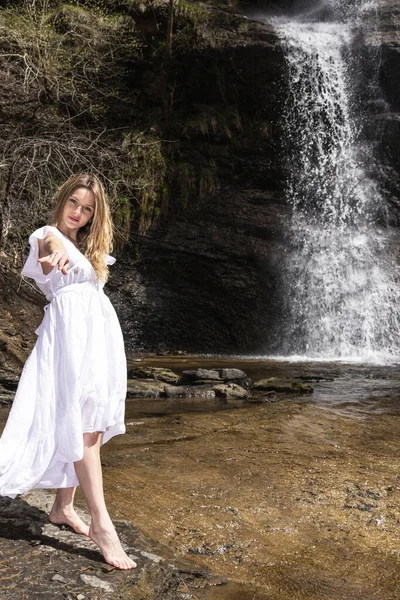 Woman White Dress Waterfall Offering Her Hand Camera — Stock Photo, Image