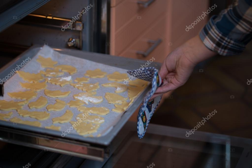 Putting cookies in oven Stock Photo by ©s2uphoto 16624315
