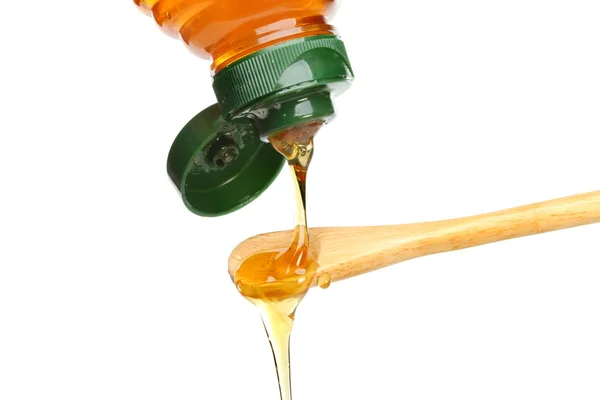 Pouring honey — Stock Photo, Image