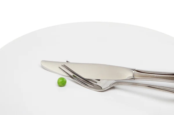 Pea cutlery on plate — Stock Photo, Image