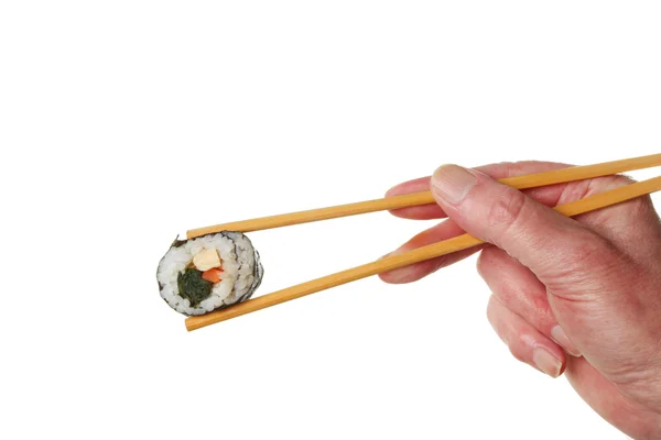 Copsticks käsi sushi — kuvapankkivalokuva