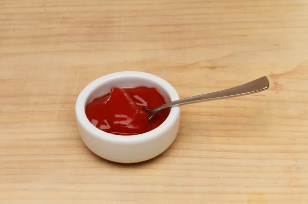 Tomato ketchup on table — Stock Photo, Image