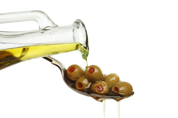 Pouring oil on olives — Stock Photo, Image