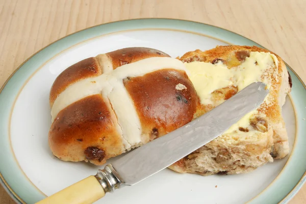 Buttered hot cross bun — Stock Photo, Image