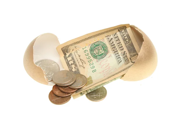 Pieniądze w golden egg — Zdjęcie stockowe