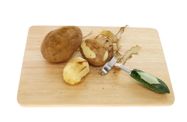 Peeling aardappelen — Stockfoto