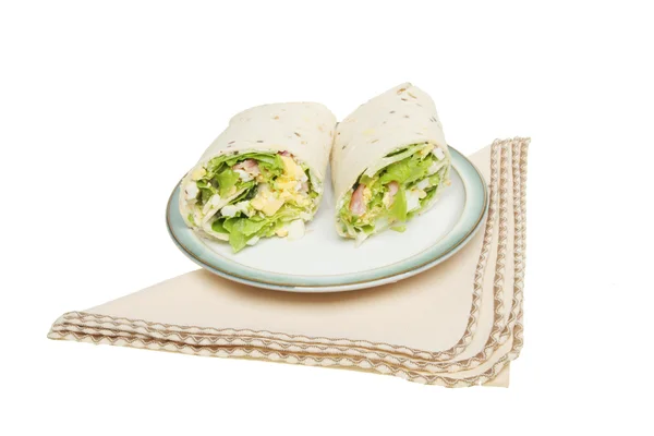 Bread wraps on a plate with a serviette — Stock Photo, Image
