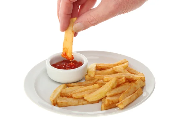 Hand dipping chip — Stock Photo, Image