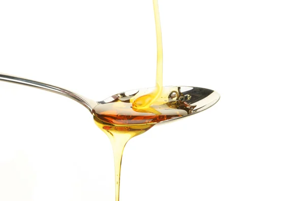 Syrup in spoon — Stock Photo, Image