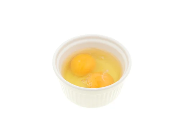 Two eggs in a ramekin — Stok fotoğraf