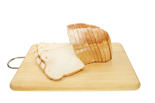 Loaf of sliced bread on a board — Stock Photo, Image