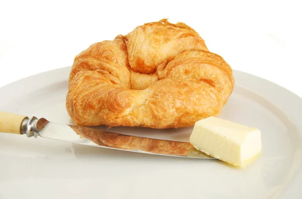 Croissant kniv och smör — Stockfoto