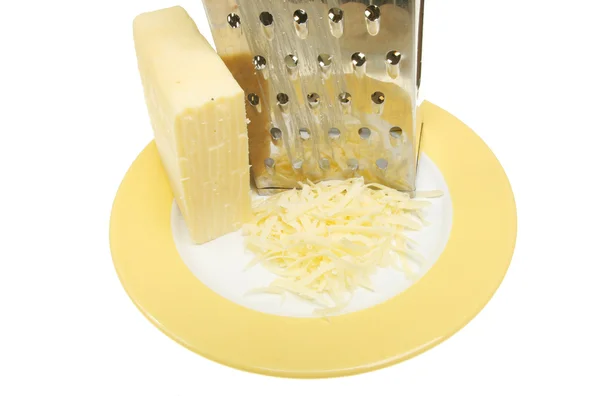 Grated cheese and grater — Stock Photo, Image