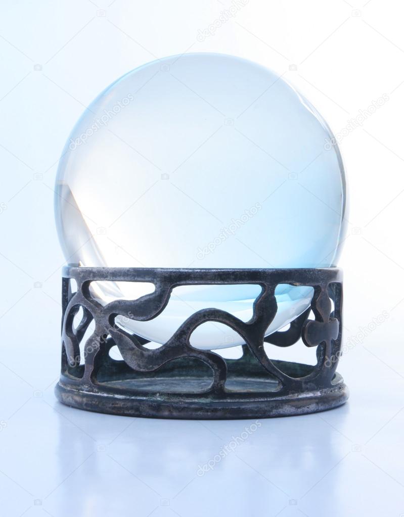 Blue crystal ball on stand