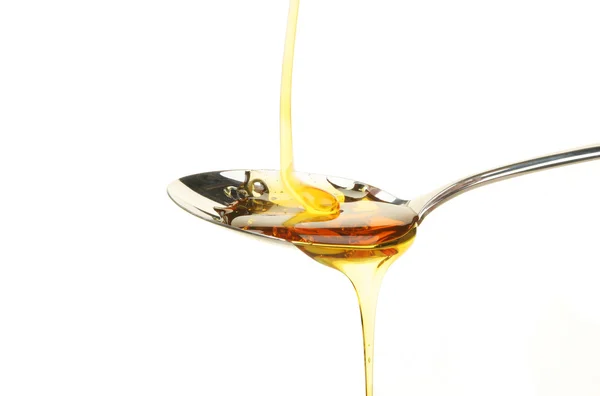 Syrup in spoon — Stock Photo, Image